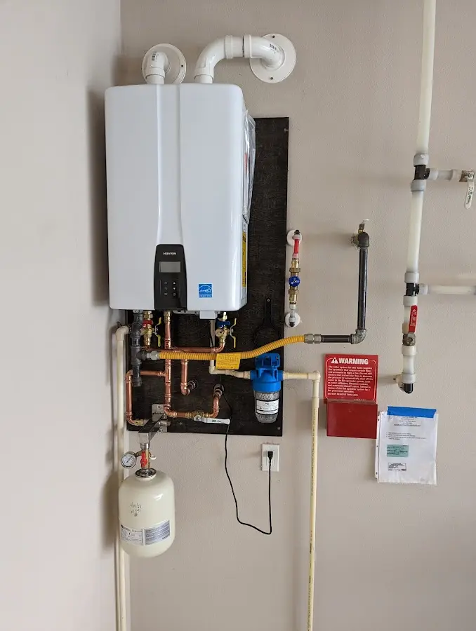 Professional plumber installing copper piping in a Eureka home